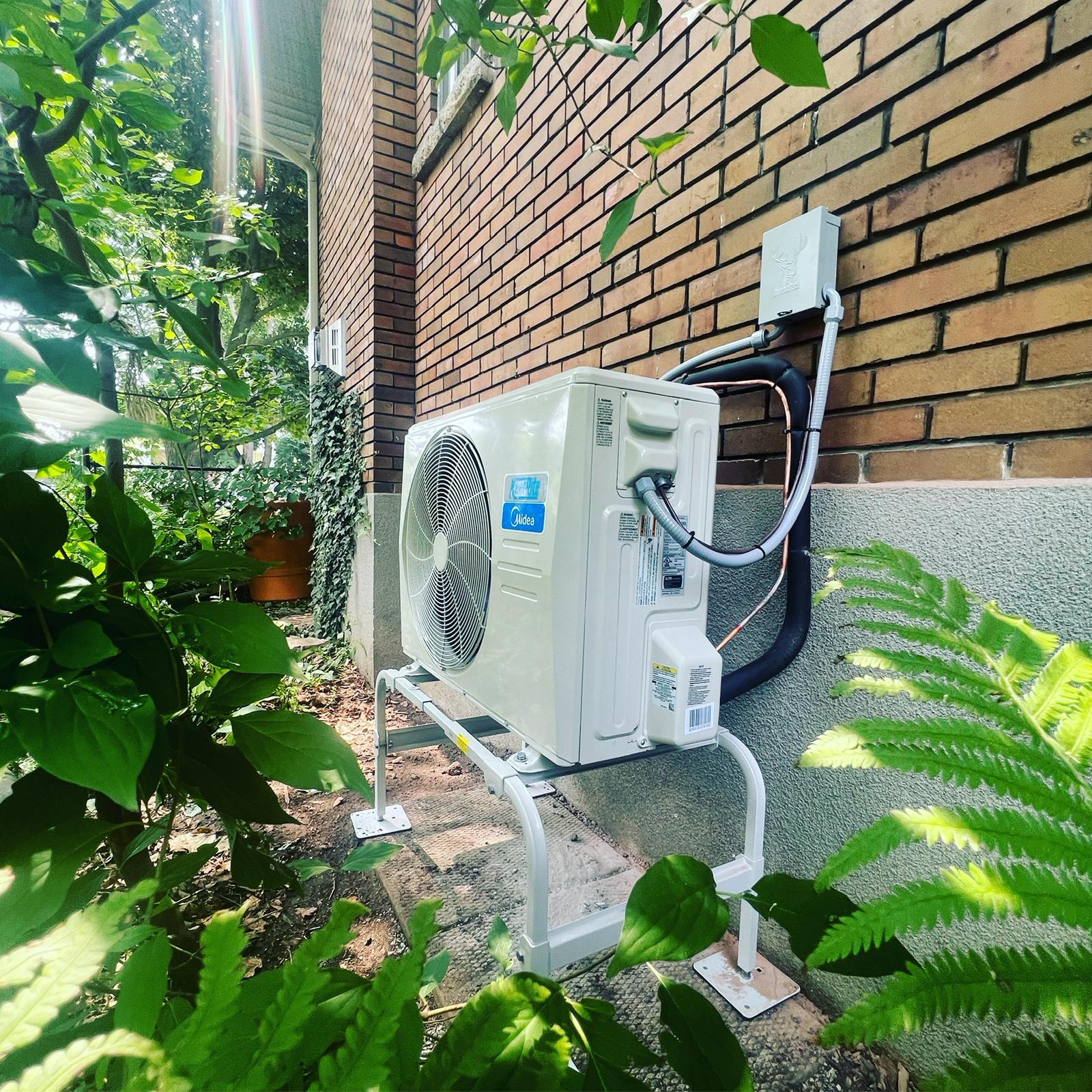 Bracken Heating and Cooling technician servicing a furnace in Cambridge, Ontario